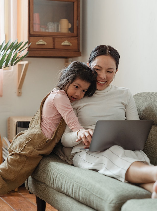 mom on ipad with child mom on ipad with child